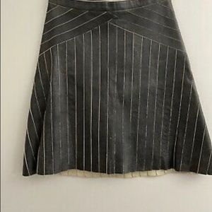 Prada Black pinstripe distressed leather mini skirt.